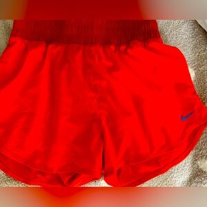 Orange and red Nike shorts